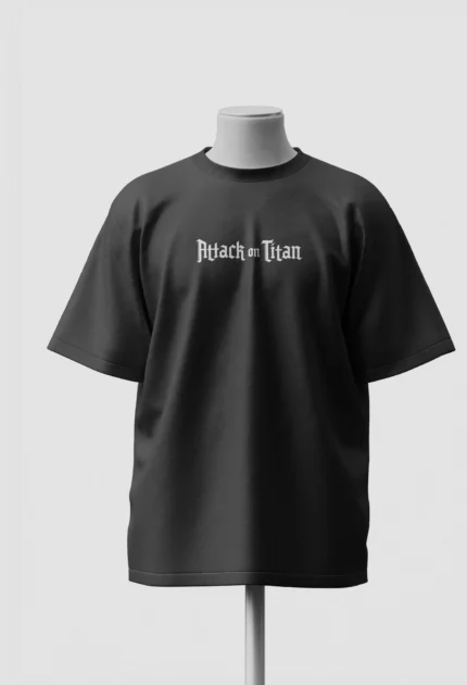 Attack on Titan gothic wordmark printed on the chest of a black oversized t-shirt