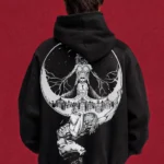 Model wearing a black Attack on Titan hoodie, back view with monochrome Titan montage