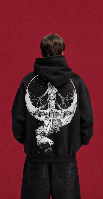 Model wearing a black Attack on Titan hoodie, back view with monochrome Titan montage