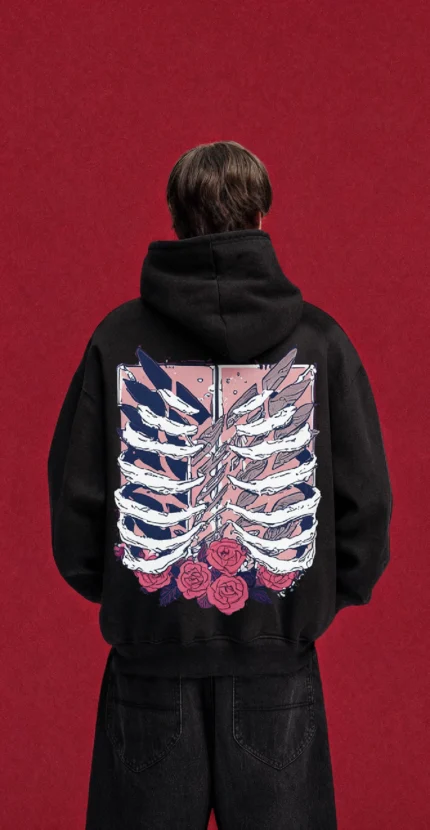 Black Attack on Titan hoodie with ribcage, wings and roses back print, worn by a model