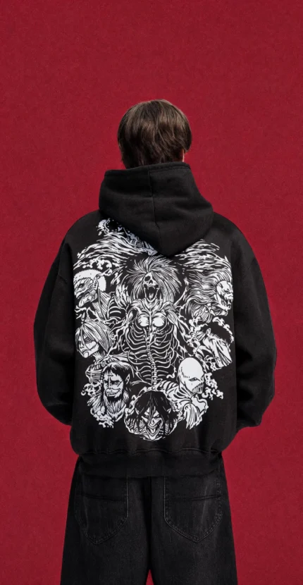 Black Attack on Titan hoodie with monochrome Titan collage back print, worn by a model