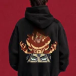 Model wearing a black Eren Attack Titan hoodie, back view with Titan and green-eye graphic